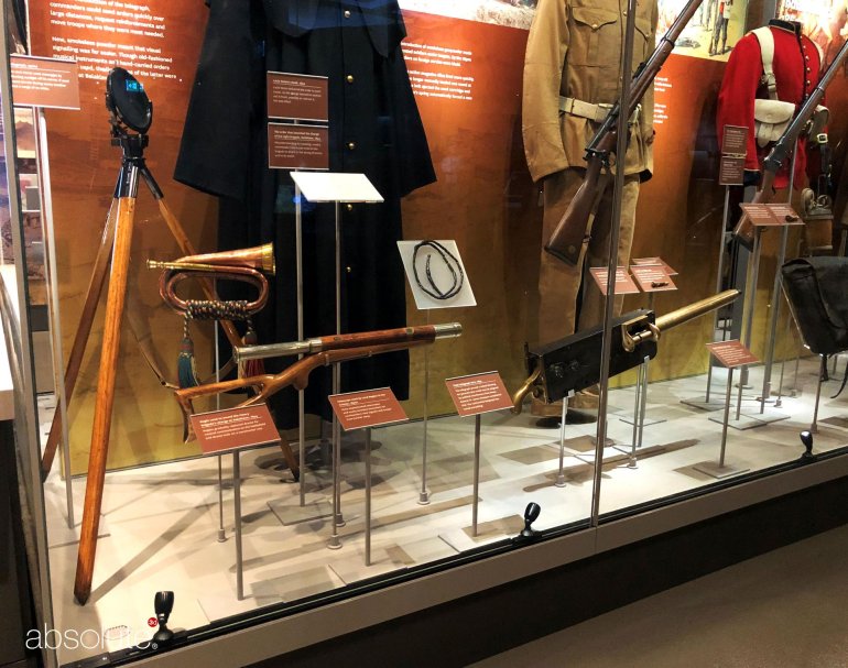 Army weapons and uniforms in a National Army Museum exhibition and correlating information displayed in pinnacle label holders.  Army weapons and uniforms in a National Army Museum exhibition and correlating information displayed in pinnacle label holders.